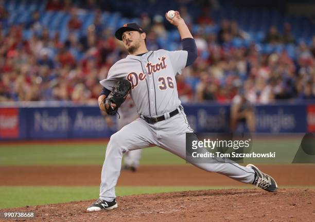 Blaine Hardy of the Detroit Tigers delivers a pitch in the eighth inning during MLB game action against the Toronto Blue Jays at Rogers Centre on...