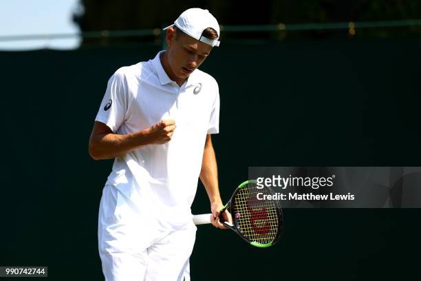 Alex De Minaur of Australia celebrates a point against Marco Cecchinato of Italy during their Men's Singles first round match on day two of the...