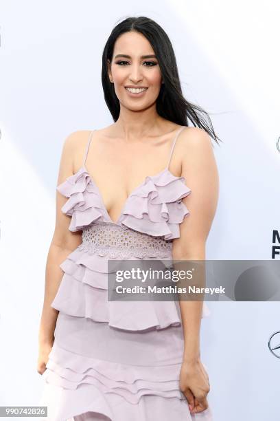 Dounia Slimani attends the Lena Hoschek show during the Berlin Fashion Week Spring/Summer 2019 at ewerk on July 3, 2018 in Berlin, Germany.