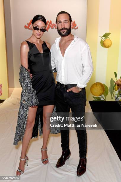 Rebecca Mir and Massimo Sinato attend the Lena Hoschek show during the Berlin Fashion Week Spring/Summer 2019 at ewerk on July 3, 2018 in Berlin,...