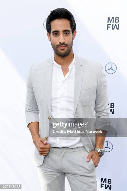 Sami Slimani attends the Lena Hoschek show during the Berlin Fashion Week Spring/Summer 2019 at ewerk on July 3, 2018 in Berlin, Germany.