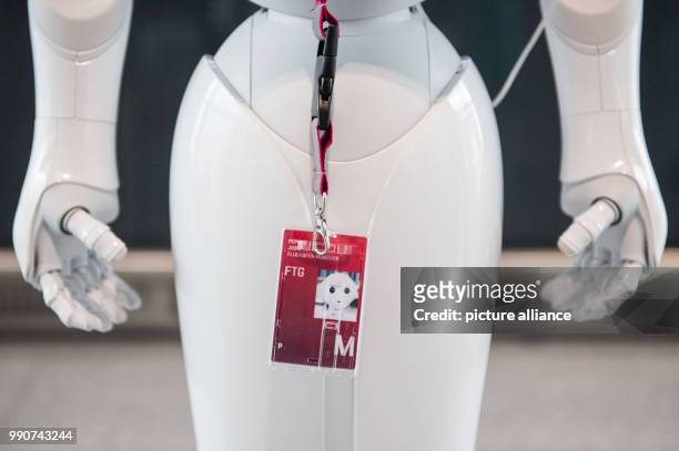 Staff card dangles around the neck of robot Josie Pepper, who assists passengers travelling from the airport in Munich, Germany, 20 February 2018....