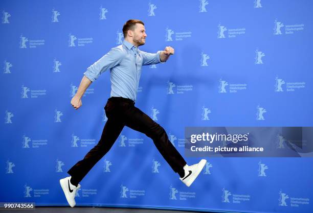 Dpatop - Actor Mateusz Kosciukievicz appears at a press conference for 'Twarz' during the 68th Berlinale International Film Festival in Berlin,...