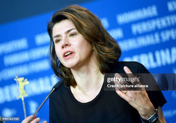 Director Malgorzata Szumovska speaks during a press conference for 'Twarz' during the 68th Berlinale International Film Festival in Berlin, Germany,...