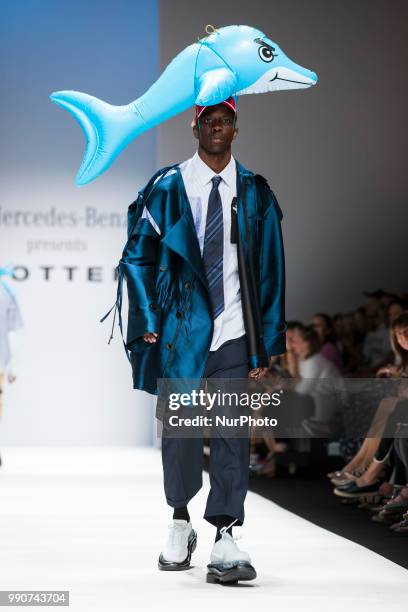 Model walks the runway at the Mercedes-Benz Presents Botter show during the Berlin Fashion Week Spring/Summer 2019 at ewerk on July 3, 2018 in...