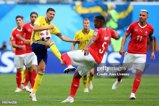 Haris Seferovic of Switzerland competes for the ball with Manuel Akanji of Switzerland during the 2018 FIFA World Cup Russia Round of 16 match...
