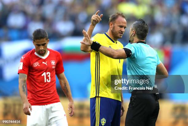 Andreas Granqvist of Sweden argues with Referee Damir Skomina during the 2018 FIFA World Cup Russia Round of 16 match between Sweden and Switzerland...