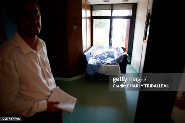 French lawmaker Francois Ruffin of the "La France Insoumise" left-wing party visits the psychiatric hospital "Pierre Janet" in Le Havre, on July 3,...