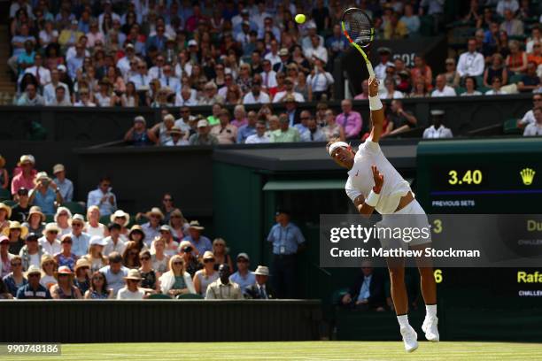 Rafael Nadal of Spain serves against Dudi Sela of Isreal during his Men's Singles first round match against on day two of the Wimbledon Lawn Tennis...