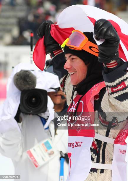 Gold medallist Sebastien Toutant from Canada celebrates his victory during the Snowboard Big Air finals in Pyeongchang, South Korea, 24 February...