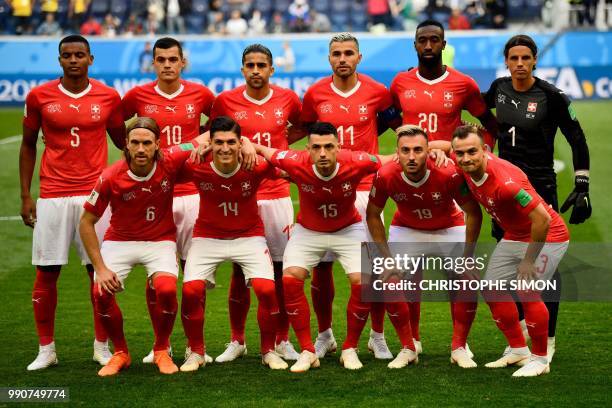 Switzerland's players defender Manuel Akanji, midfielder Granit Xhaka, defender Ricardo Rodriguez, midfielder Valon Behrami, defender Johan Djourou,...