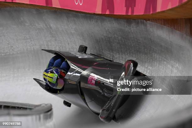 Brazilian bobsleighers Edson Bindilatti, Ordilei Pessoni, Edson Ricardo Martins and Rafael Souza da Silva slide during the first round at the...