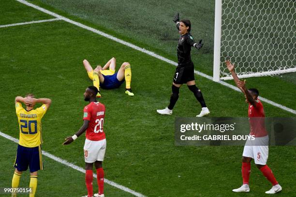 Switzerland's goalkeeper Yann Sommer and Switzerland's defender Manuel Akanji react during the Russia 2018 World Cup round of 16 football match...