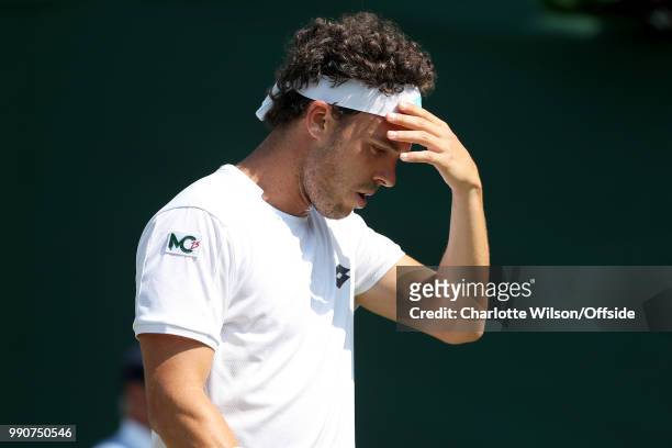 Marco Cecchinato v Alex de Minaur - A dejected Marco Cecchinato at All England Lawn Tennis and Croquet Club on July 3, 2018 in London, England.