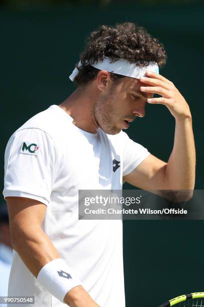 Marco Cecchinato v Alex de Minaur - A dejected Marco Cecchinato at All England Lawn Tennis and Croquet Club on July 3, 2018 in London, England.