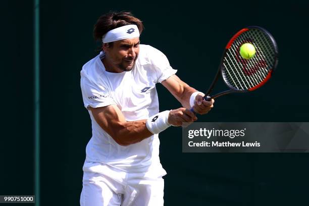 David Ferrer of Spain returns against Karen Khachanov of Russia during their Men's Singles first round match on day two of the Wimbledon Lawn Tennis...