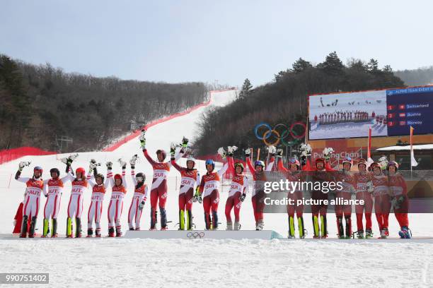 Switzerland takes home gold, while the Austrian team takes silver and the Norwegians won bronze at the mixed team alpine skiing finals in...