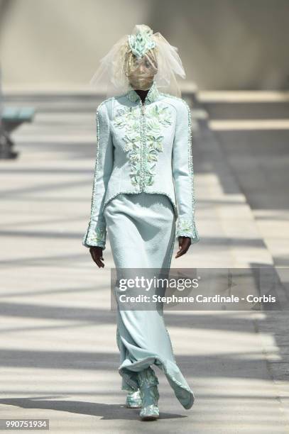 Model Adut Akech walks the runway during the Chanel Haute Couture Fall Winter 2018/2019 show as part of Paris Fashion Week on July 3, 2018 in Paris,...