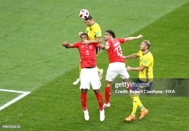 Marcus Berg of Sweden wins a header from Manuel Akanji of Switzerland during the 2018 FIFA World Cup Russia Round of 16 match between Sweden and...
