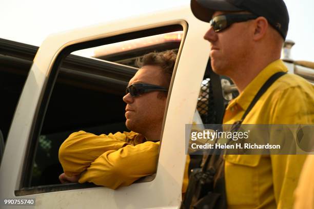 Arvada Fire Department wildland firefighters Justin Cotsamire, left, and Patrick Jungels, on Brush 58, watch for hot spots while helping to fight the...