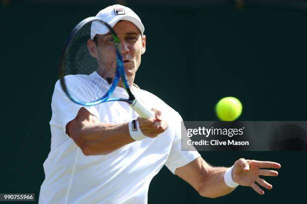 Matthew Ebden of Australia returns against David Goffin of Belgium during their Men's Singles first round match on day two of the Wimbledon Lawn...