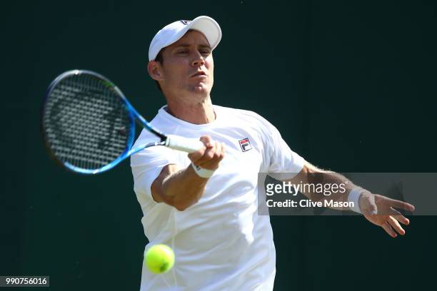 Matthew Ebden of Australia returns against David Goffin of Belgium during their Men's Singles first round match on day two of the Wimbledon Lawn...