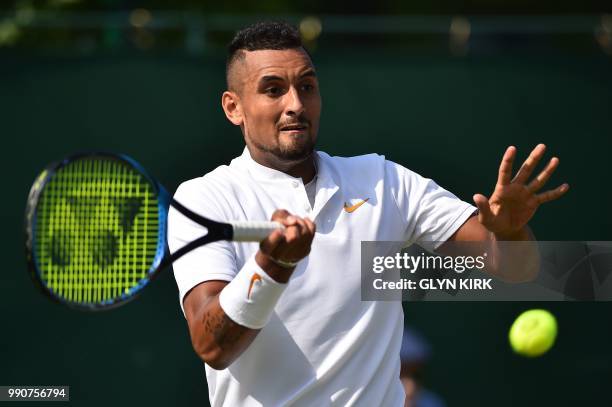 Australia's Nick Kyrgios returns against Uzbekistan's Denis Istomin during their men's singles first round match on the second day of the 2018...