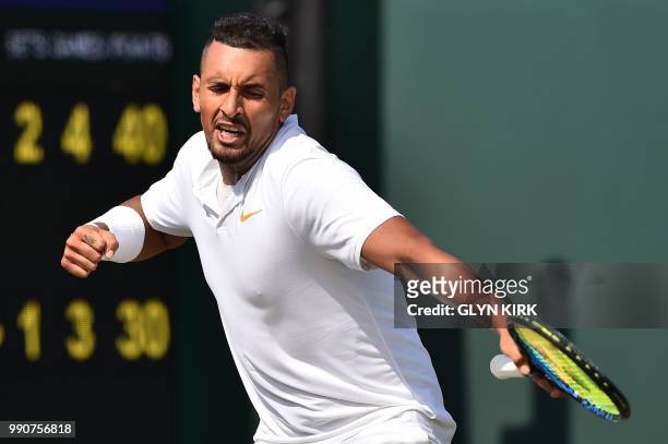 Australia's Nick Kyrgios celebrates winning a point against Uzbekistan's Denis Istomin during their men's singles first round match on the second day...