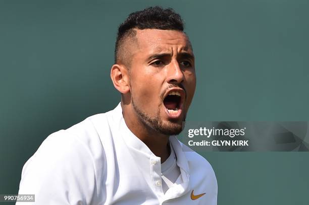 Australia's Nick Kyrgios celebrates winning a point against Uzbekistan's Denis Istomin during their men's singles first round match on the second day...