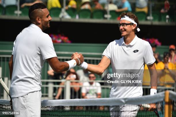 Australia's Nick Kyrgios shakes hands after winning against Uzbekistan's Denis Istomin during their men's singles first round match on the second day...