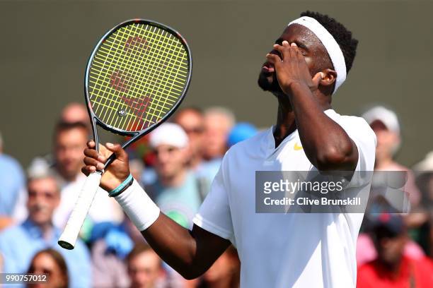 Frances Tiafoe of the United States reacts during his Men's Singles first round match against Fernando Verdasco of Spain on day two of the Wimbledon...
