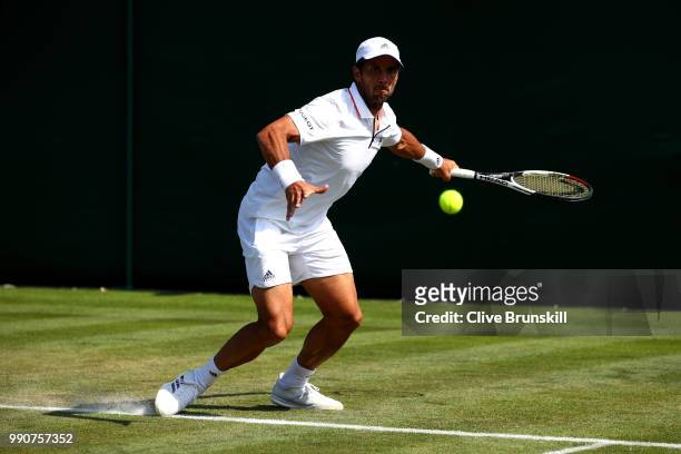 Fernando Verdasco of Spain returns against Frances Tiafoe of the United States during their Men's Singles first round match on day two of the...