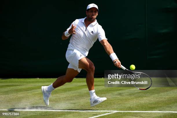 Fernando Verdasco of Spain returns against Frances Tiafoe of the United States during their Men's Singles first round match on day two of the...
