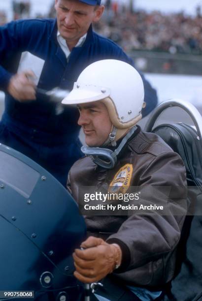 Driver Pat O'Connor sits in his car before the start of the USAC 100 mile championship race on March 30, 1958 in Trenton, New Jersey.