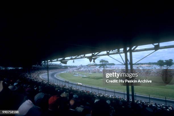 General view as cars race around the track during the 39th Indianapolis 500 on May 30, 1955 at the Indianapolis Speedway in Indianapolis, Indiana.