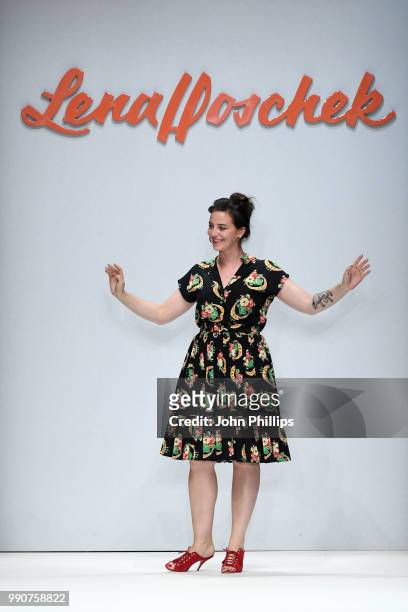 Designer Lena Hoschek responds to applause after her show during the Berlin Fashion Week Spring/Summer 2019 at ewerk on July 3, 2018 in Berlin,...