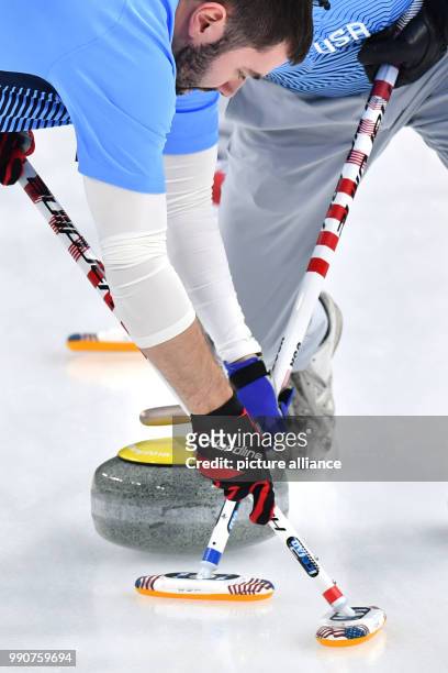 S John Landsteiner and Tyler George in action at the men's curling finals against Sweden at the Curling Centre in Gangneung, South Korea, 24 February...