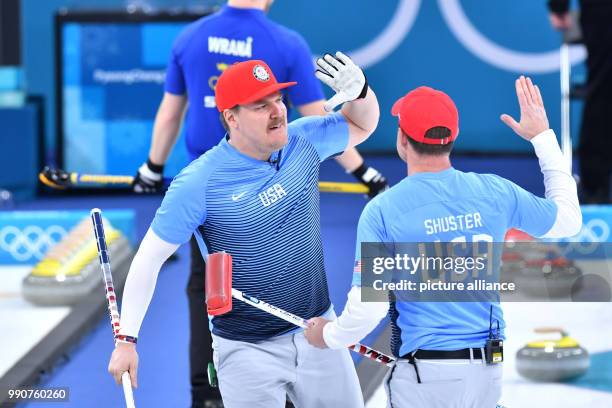 S Matt Hamilton and John Shuster celebrate winning gold at the men's curling finals against Sweden at the Curling Centre in Gangneung, South Korea,...