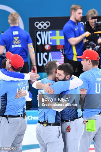 S John Shuster , Tyler George, John Landsteiner and Matt Hamilton celebrate winning gold at the men's curling finals against Sweden at the Curling...