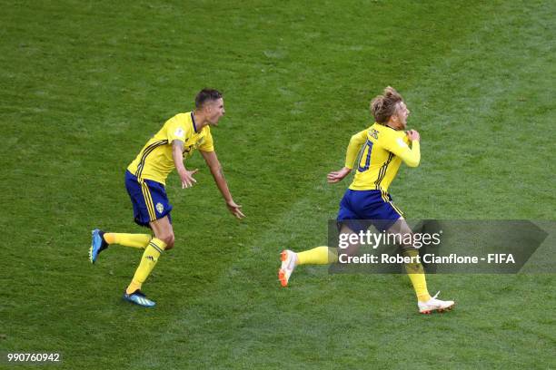 Emil Forsberg of Sweden celebrates with team mate Mikael Lustig after scoring his team's first goal with team mates during the 2018 FIFA World Cup...