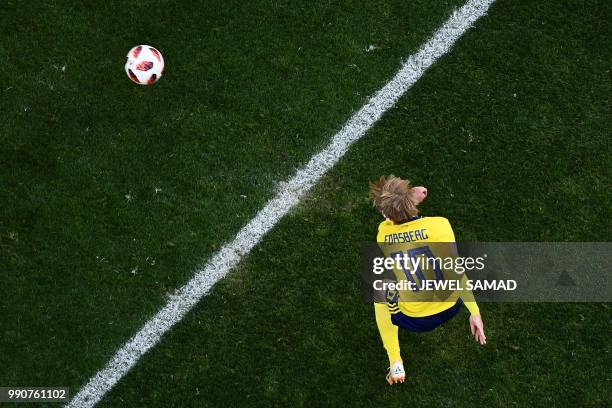 Sweden's midfielder Emil Forsberg kicks and scores during the Russia 2018 World Cup round of 16 football match between Sweden and Switzerland at the...