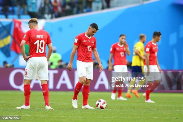 Blerim Dzemaili of Switzerland looks dejected after his side concede during the 2018 FIFA World Cup Russia Round of 16 match between Sweden and...