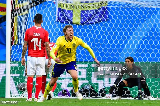 Sweden's midfielder Emil Forsberg celebrates scoring during the Russia 2018 World Cup round of 16 football match between Sweden and Switzerland at...