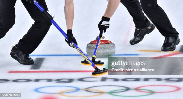 Sweden's Christoffer Sundgren and Rasmus Wranaa in action at the men's curling finals between the US and Sweden at the Curling Centre in Gangneung,...