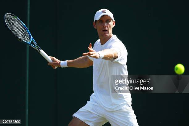 Matthew Ebden of Australia returns against David Goffin of Belgium during their Men's Singles first round match on day two of the Wimbledon Lawn...