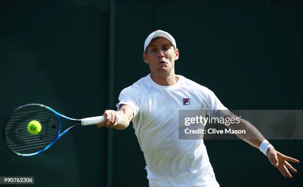 Matthew Ebden of Australia returns against David Goffin of Belgium during their Men's Singles first round match on day two of the Wimbledon Lawn...