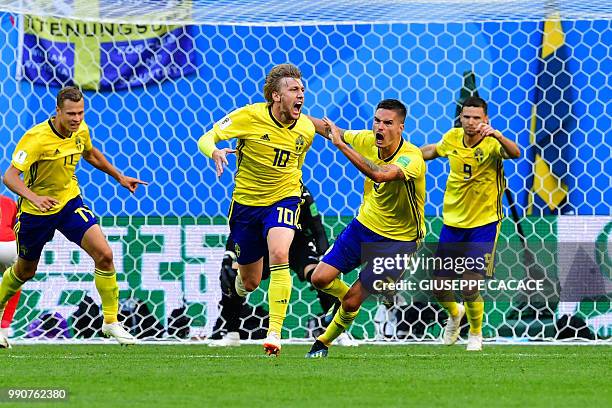 Sweden's midfielder Emil Forsberg celebrates scoring during the Russia 2018 World Cup round of 16 football match between Sweden and Switzerland at...
