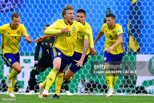 Sweden's midfielder Emil Forsberg celebrates scoring during the Russia 2018 World Cup round of 16 football match between Sweden and Switzerland at...