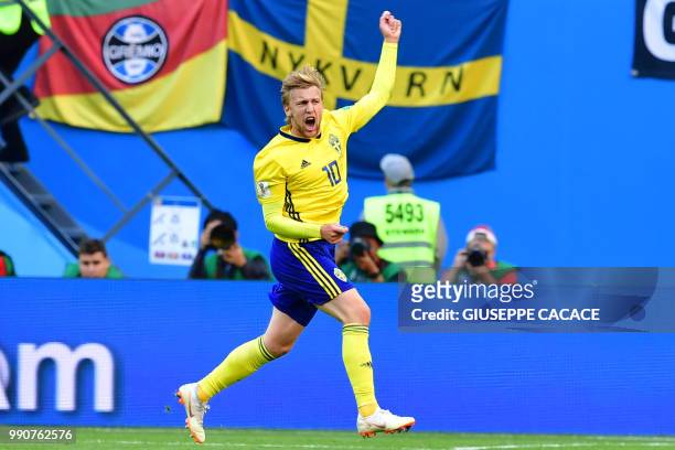 Sweden's midfielder Emil Forsberg celebrates scoring during the Russia 2018 World Cup round of 16 football match between Sweden and Switzerland at...