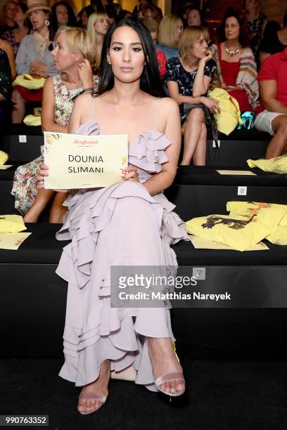 Dounia Slimani attends the Lena Hoschek show during the Berlin Fashion Week Spring/Summer 2019 at ewerk on July 3, 2018 in Berlin, Germany.